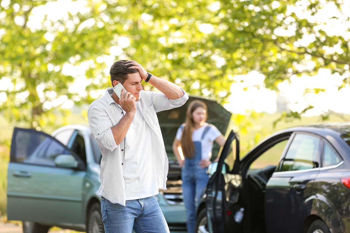 Man at car accident scene