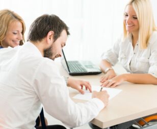 Couple signing a prenup