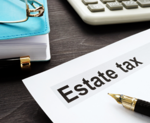 Estate tax form on a desk with a blue notebook